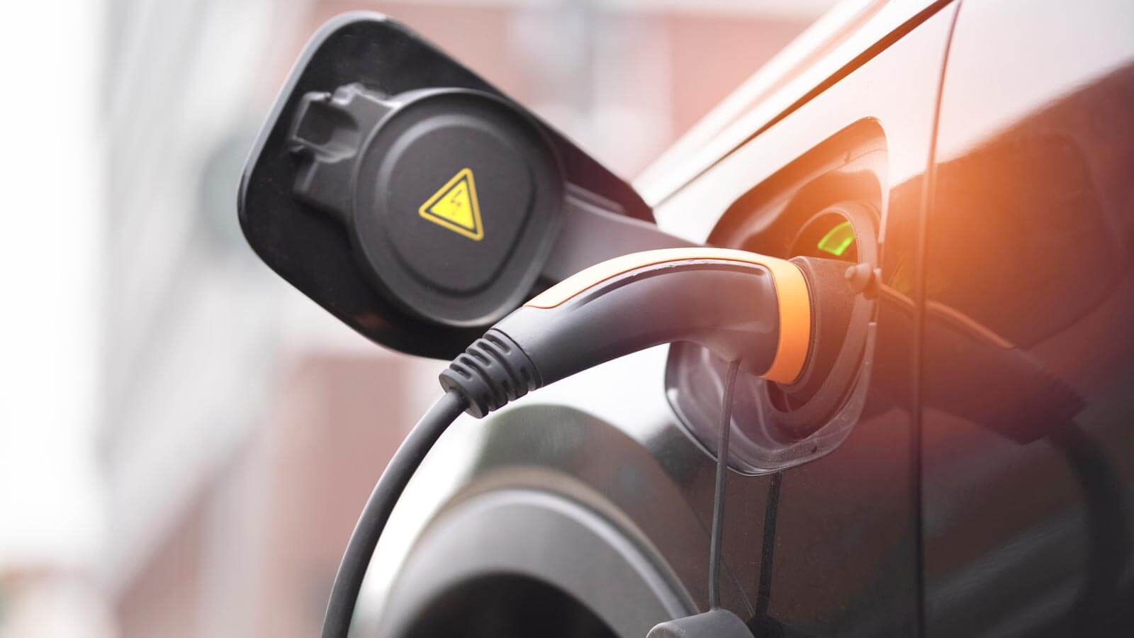 Nachhaltigkeit bei eTASK und mit E-Auto QR-Giro-Code